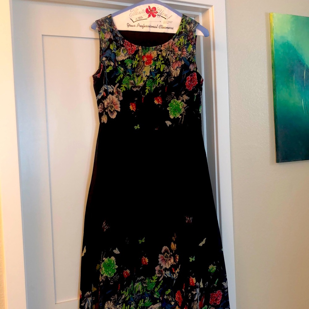 Never been worn ladies dress. Black with multi floral print. From berkoko.com